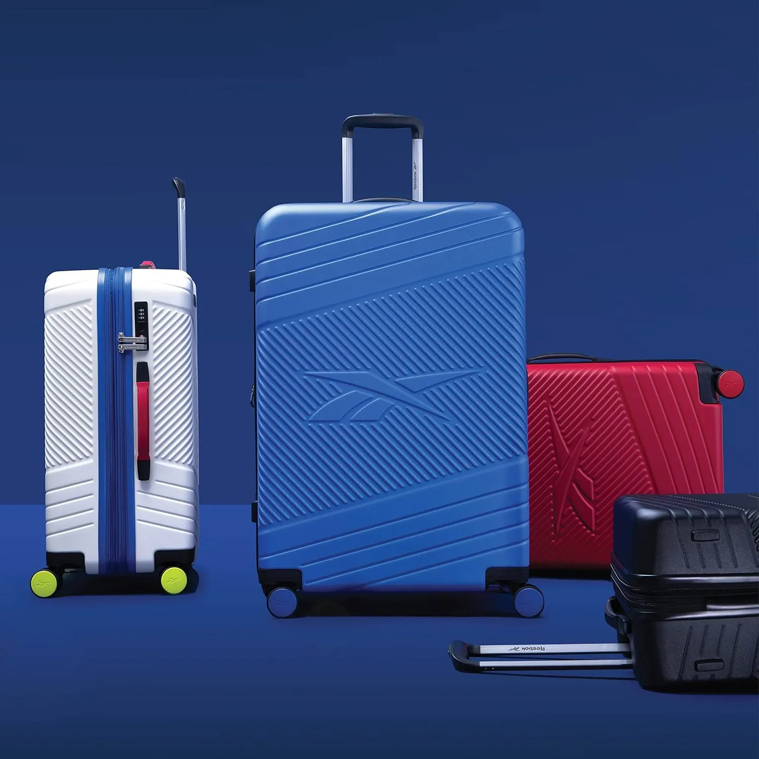Reebok Go Collection 28 Inch Hard Shell Luggage for Airplanes, Large ABS/PC Hardside Expandable Suitcase with 360-Degree Spinner Wheels, Retractable Handle, Includes Shoe Bag, Blue